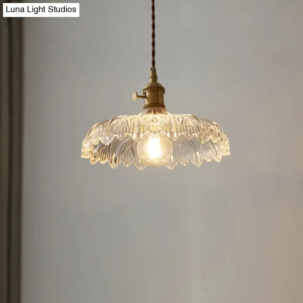 Clear scalloped edge glass pendant ceiling light with brass fixture and twisted cord for industrial decor