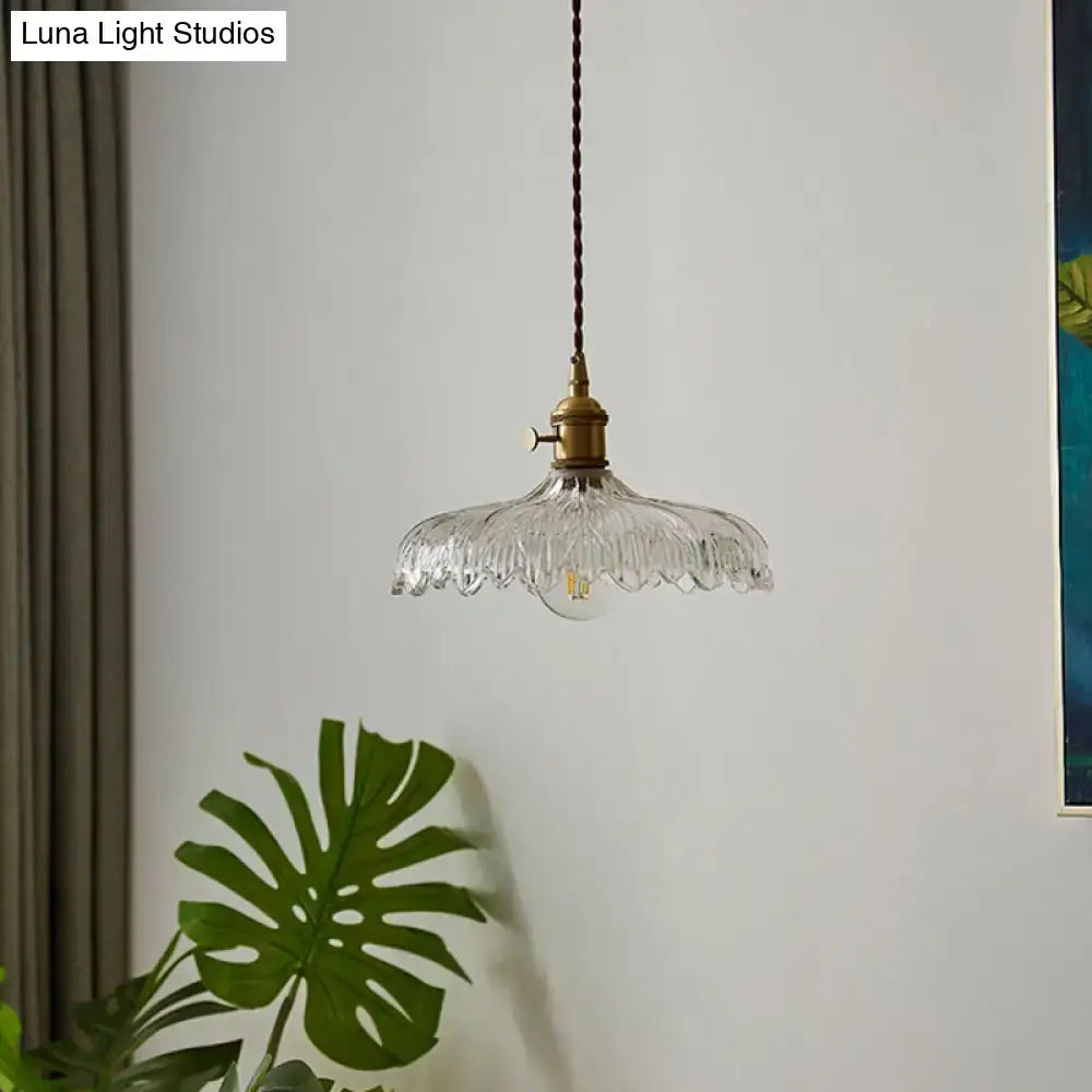Clear glass scalloped edge pendant ceiling light with textured design and brass hardware by DecorBites for restaurants