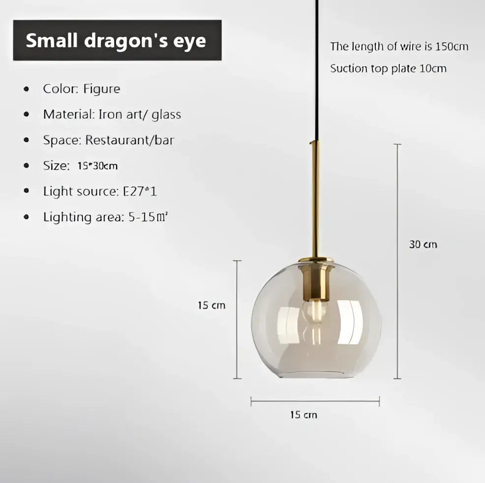 Industrial smoked glass and brass pendant light with transparent globe designed as a small dragon eye decorbites industrial glass pendant