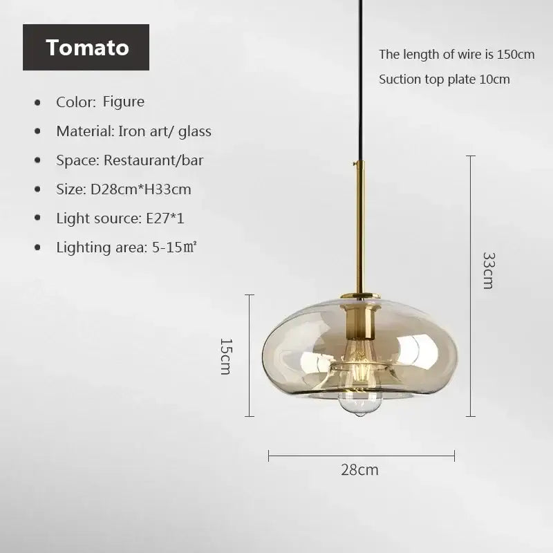 A modern decorbites industrial glass pendant light with translucent amber shade and brass hardware for dining room decor