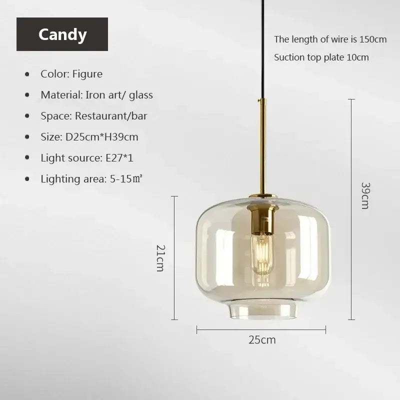 A modern industrial glass pendant light with smoked clear globe and brass accents for dining room decorbites industrial glass