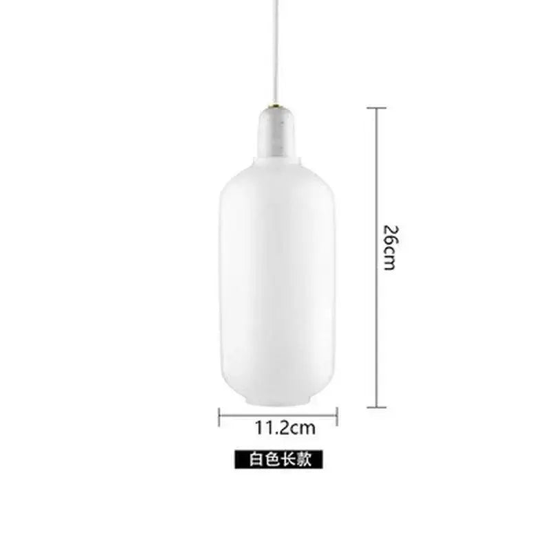 A sleek opaque white pendant light with a cylindrical glass shade in decorbites industrial stained glass style for dining room