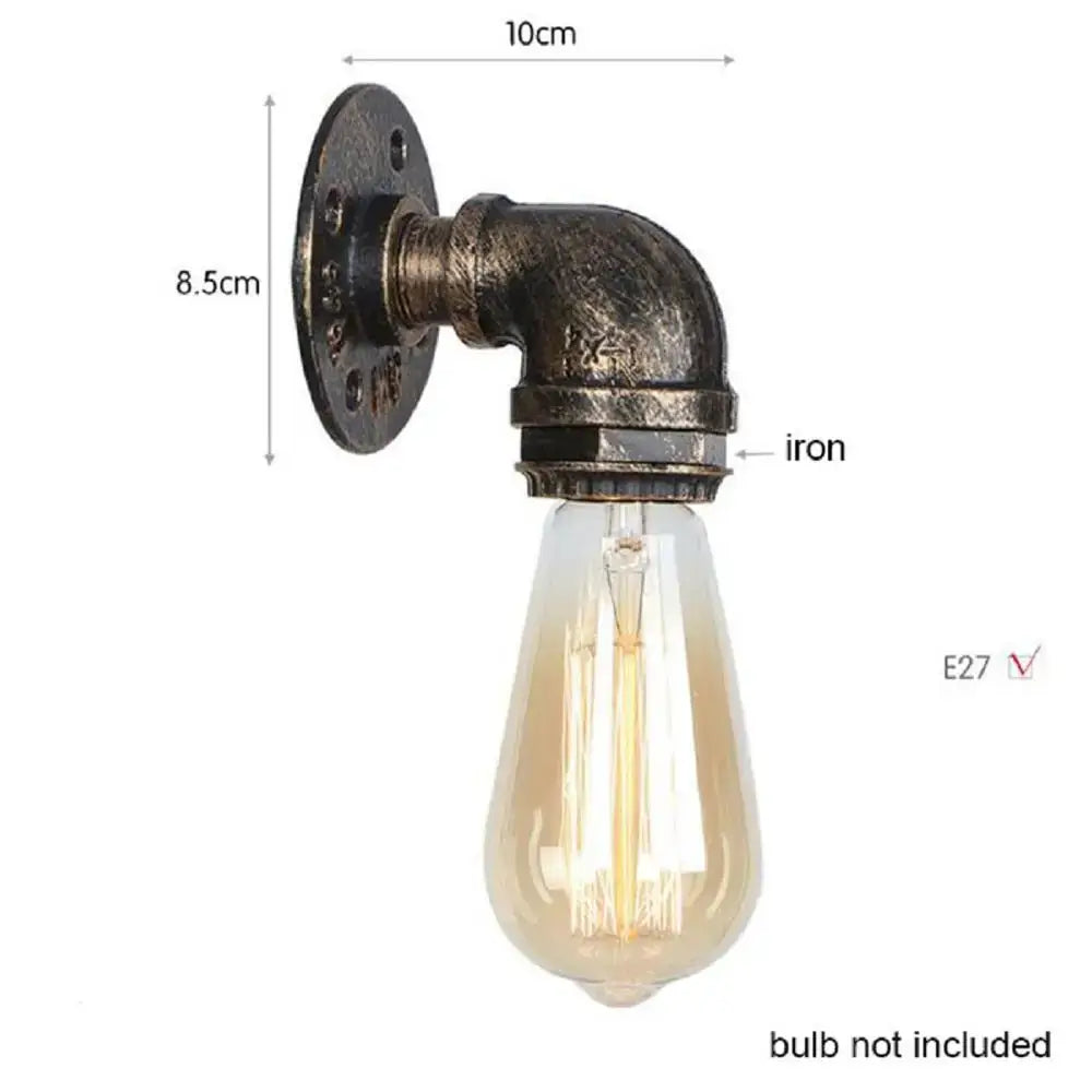 Industrial steampunk loft pipe wall lamp with black iron pipes, aged brass finish, and exposed filament bulb decorbites steampunk loft
