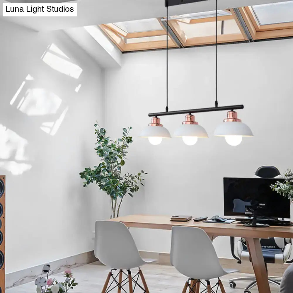 DecorBites™ industrial style three-light pendant light fixture with black metal bar, rose gold accents, and white ceramic shades