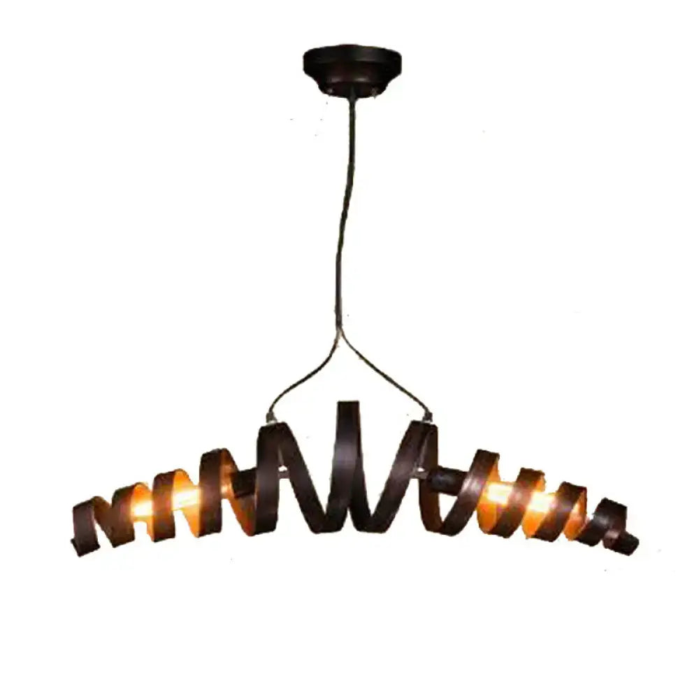 Industrial style dark bronze spiral metal pendant light with warm glowing bulbs for dining room or spiral metal island use