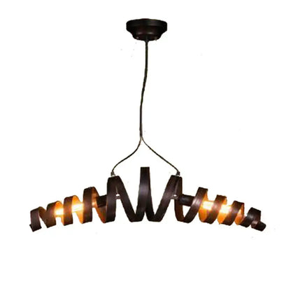 Industrial style dark bronze spiral metal pendant light with warm glowing bulbs for dining room or spiral metal island use