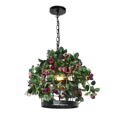 Black metal cage pendant light with lush green foliage and pink purple artificial roses decorbites industrial style rose chandelier