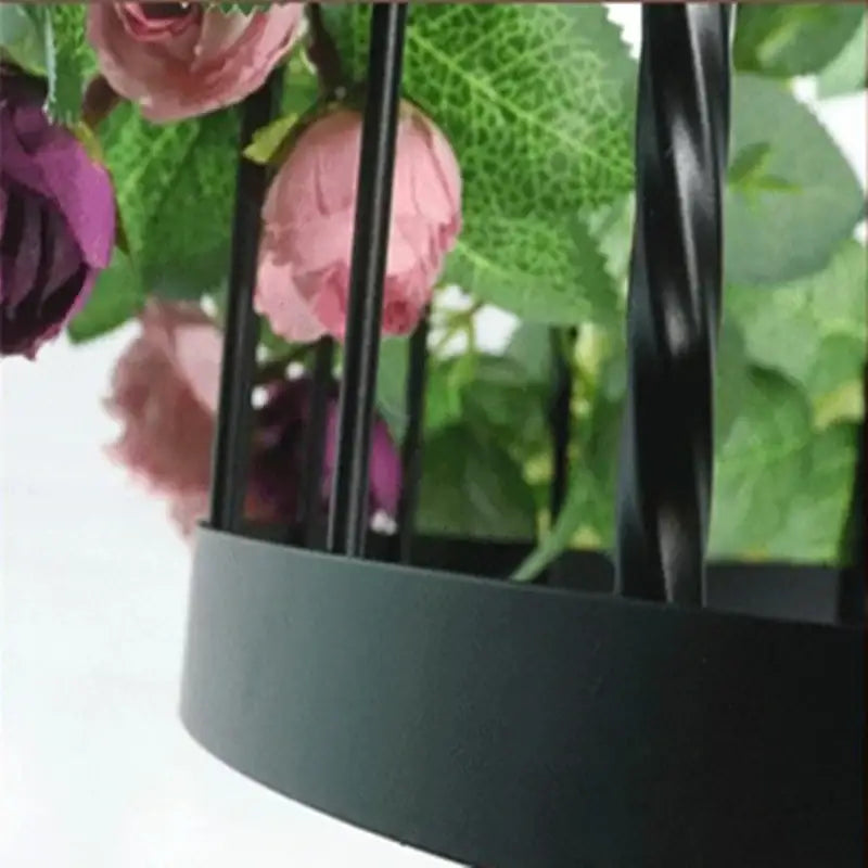 Black metal birdcage with pink and purple artificial flowers in decorbites industrial style rose chandelier pendant