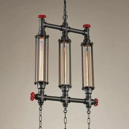 Decorbites industrial style tubular pendant light in black metal with three glass tubes and red valve accents for restaurants