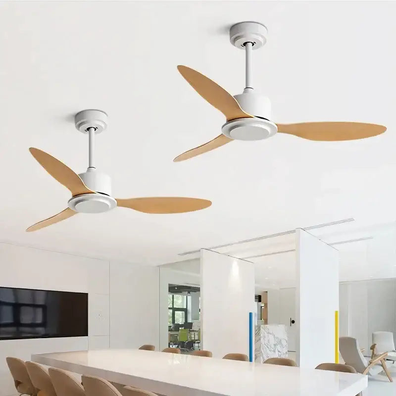 Industrial style ceiling fan with sleek white motor housing, light brown wooden blades, and remote control for bedroom use