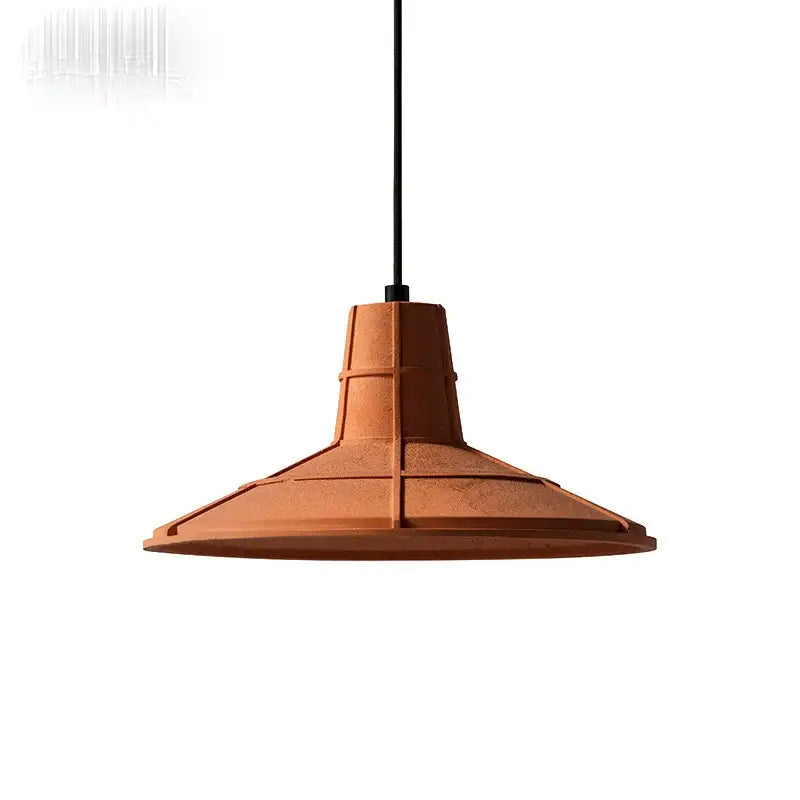 Industrial terracotta cement pendant lamp with geometric segments and matte finish hanging by black cord decorbites cement pendant
