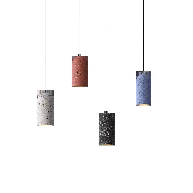 Four industrial terrazzo cement pendant lights in white pink blue and black hang for kitchen and dining room decorbites cement pendant lights