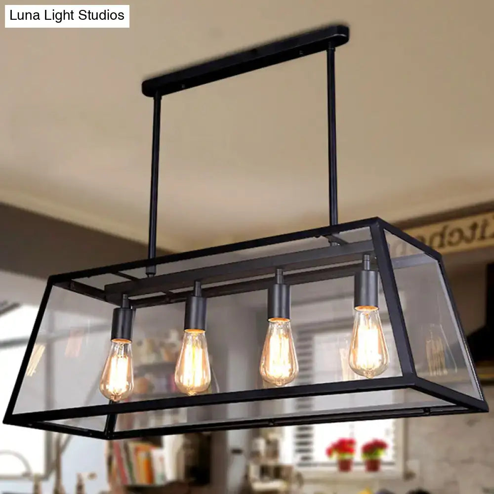 Black metal rectangular pendant island lamp with clear glass panels and four edison bulbs on chain downrods