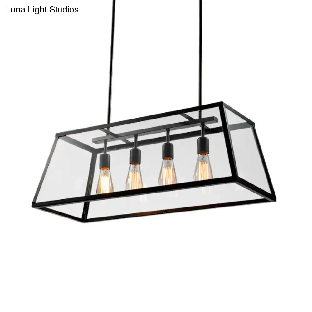 Black framed industrial trapezoid island lamp with clear glass panels and four exposed filament bulbs by decorbites