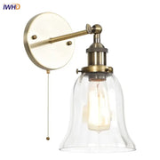 Antique brass wall sconce with clear glass bell shade and exposed Edison bulb for decorbites industrial vintage bedroom decor
