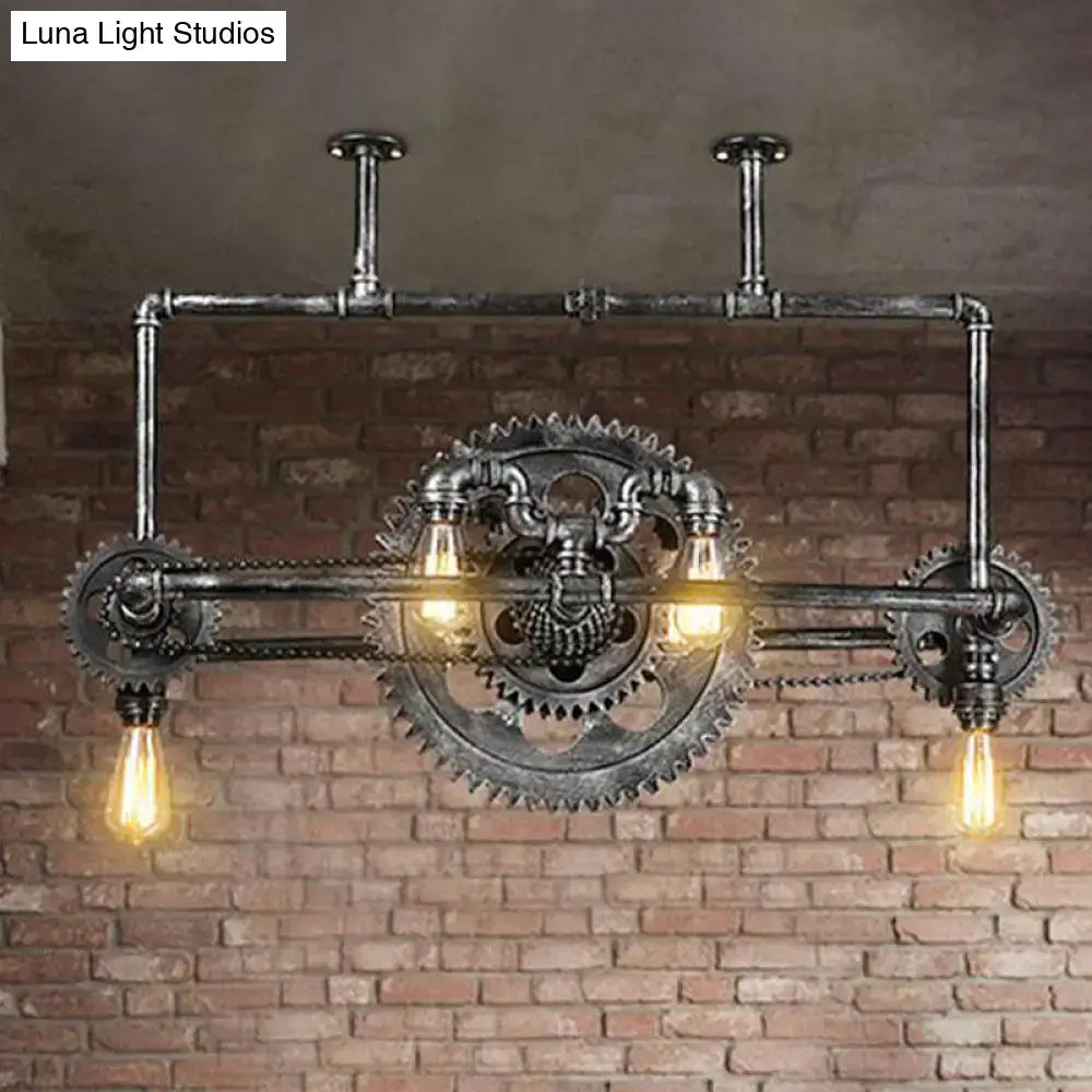 Industrial vintage black gear chandelier featuring dark metallic pipes and exposed Edison bulbs for dining room lighting