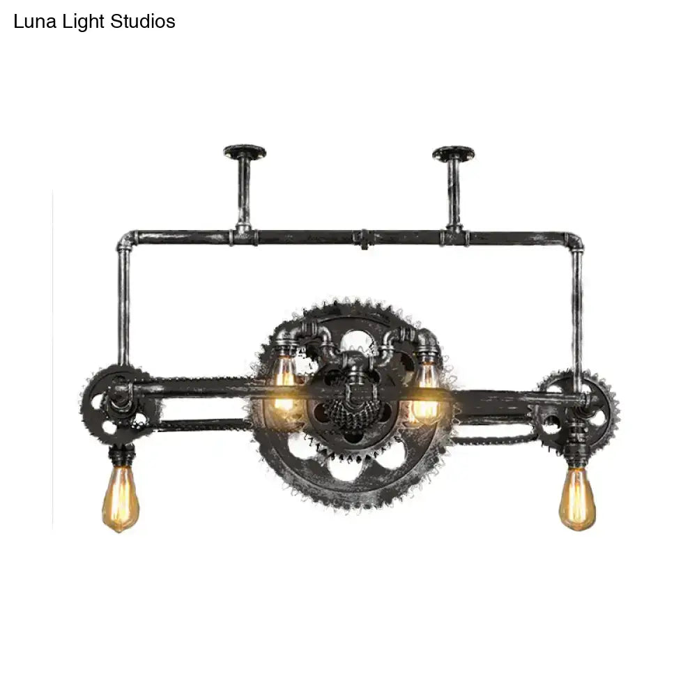 Industrial vintage black gear chandelier with dark rustic metal pipes and three exposed edison bulbs for dining room use