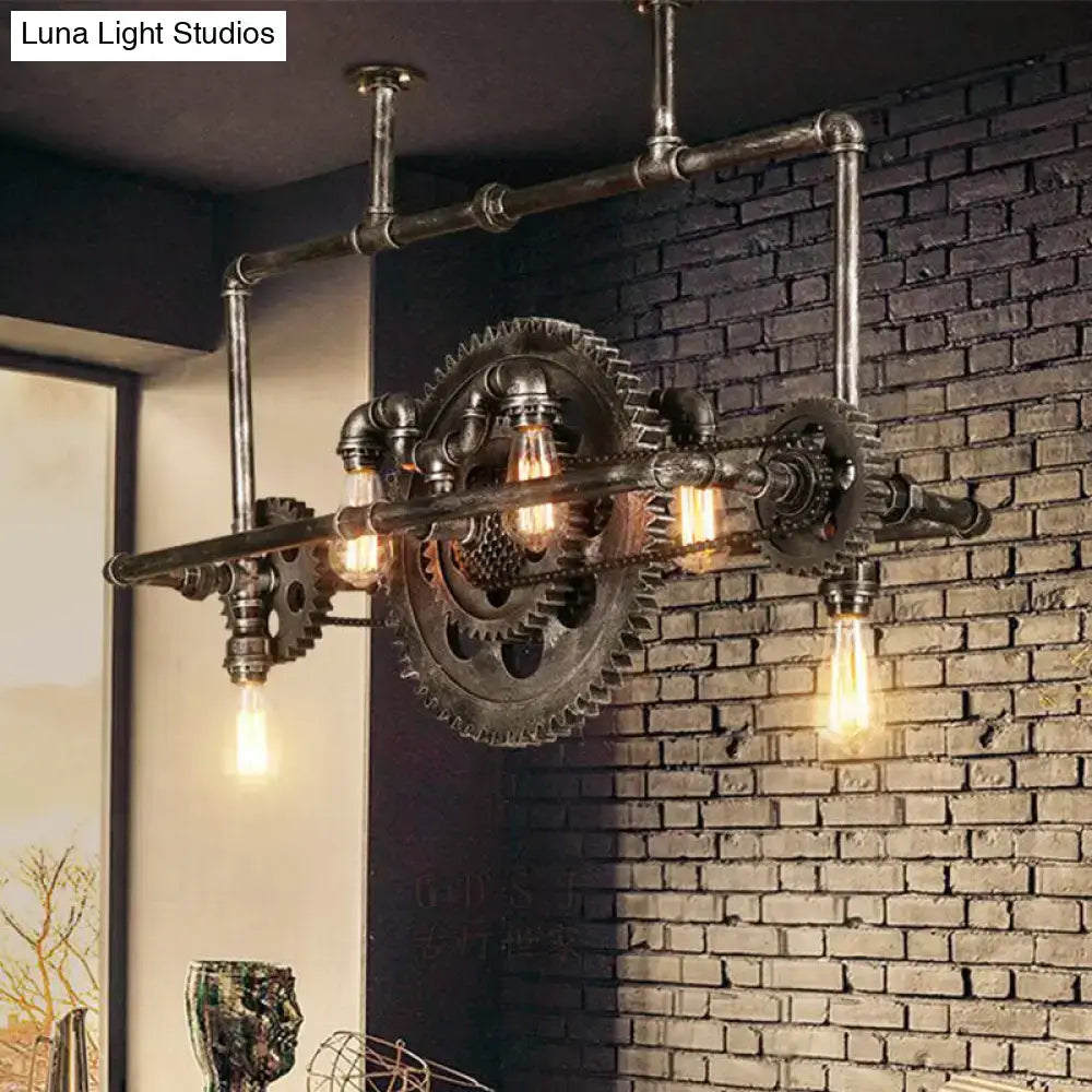 Industrial vintage black gear chandelier with dark metal pipes and exposed Edison bulbs for dining room lighting