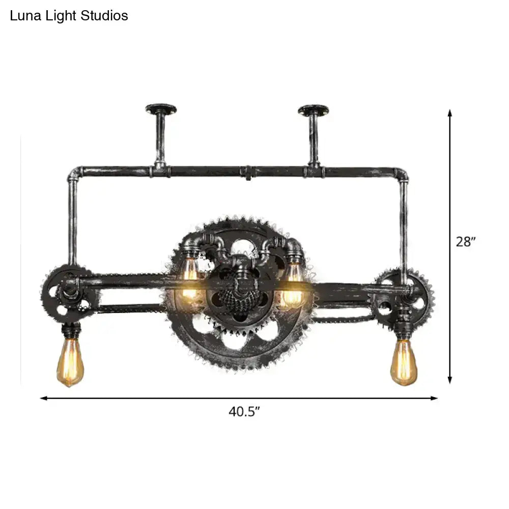Industrial vintage black gear chandelier featuring black pipe with three exposed edison filament bulbs for dining room