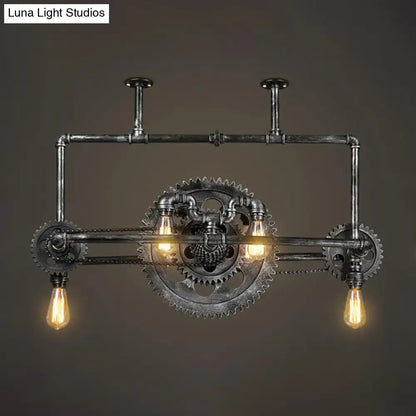 Industrial vintage black gear chandelier with dark metallic pipes and exposed edison bulbs for dining room lighting