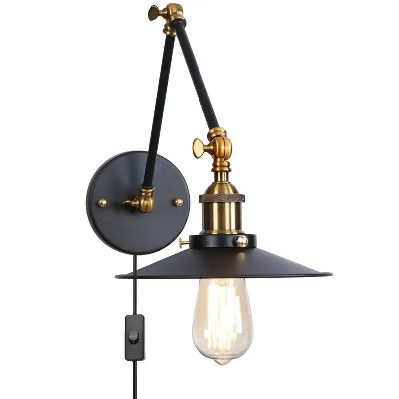 Industrial vintage black iron wall light with adjustable long arm black metal shade brass accents and exposed edison bulb decorbites black iron wall light