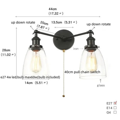 Black iron wall lamp with two adjustable arms and clear glass shades featuring exposed Edison bulbs decorbites black led