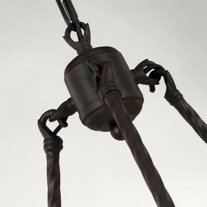 Dark bronze wrought iron industrial vintage chandelier with twisted chain links and claw-like support arms for kitchens decorbites industrial vintage