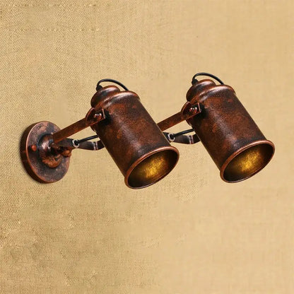 Vintage-style copper finish industrial wall lamp with two adjustable spotlight arms decorbites wall lamp design
