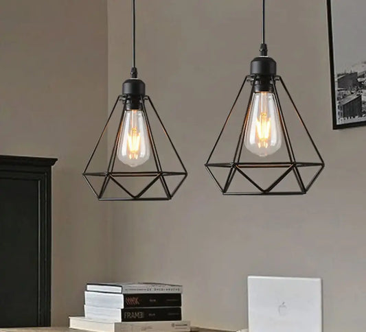 Black industrial vintage iron cage pendant light with geometric design and exposed filament bulbs for decorbites decor
