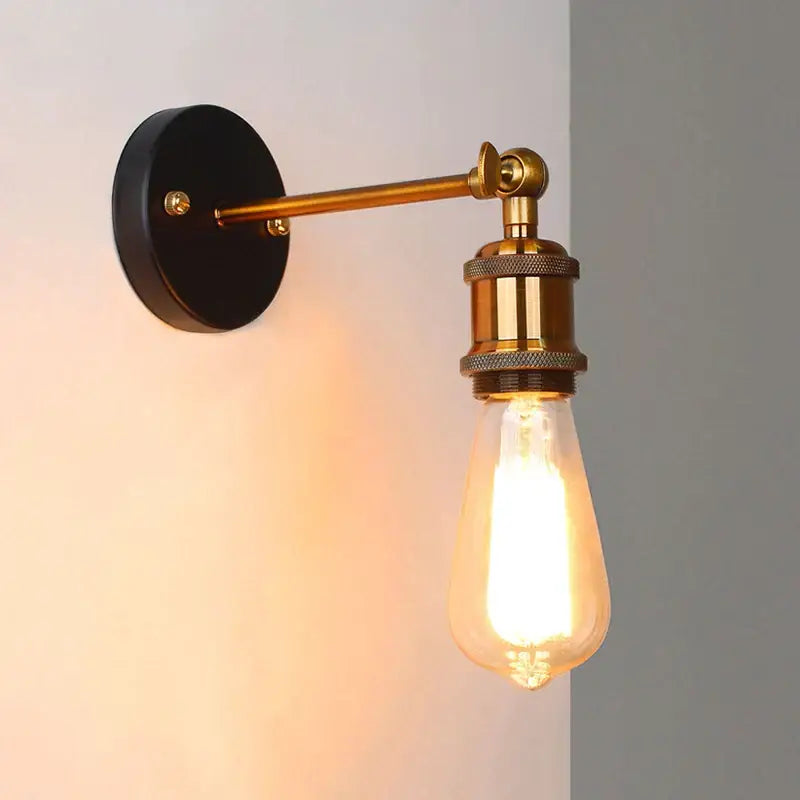 Vintage-style brass wall lamp with black base and exposed edison bulb decorbites industrial vintage loft sconce