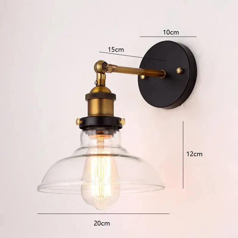 Industrial vintage loft wall lamp with brass arm black base clear glass dome and exposed edison bulb decorbites industrial vintage