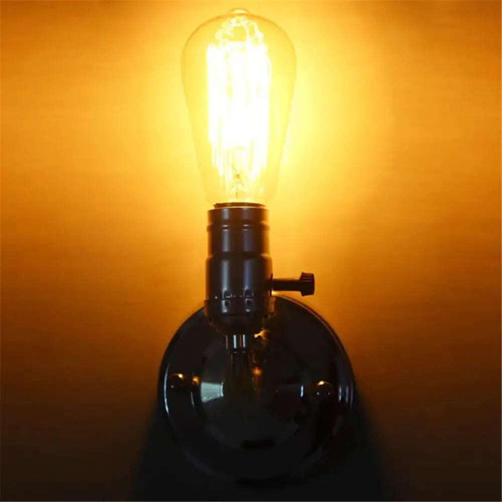 Warm-toned industrial vintage wall sconce lamp with clear glass bulb and dark metal base set of 4 for bedroom use