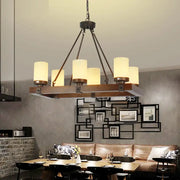 Industrial vintage living room chandelier with white glass shades, dark metal frame, wooden crossbar island lamp design