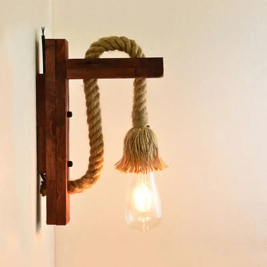 Rustic wooden wall lamp with beige rope and frayed tassel featuring exposed Edison bulb decorbites industrial vintage decor