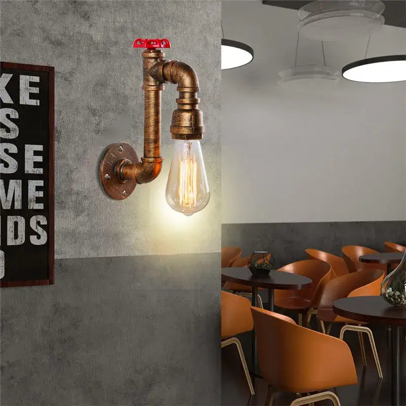 Industrial water pipe wall sconce crafted from brass pipe with red valve handle and exposed edison bulb for corridor decorbites industrial water