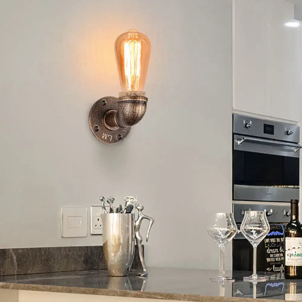 Industrial water pipe wall sconce in black and brass with exposed edison bulb perfect for kitchen decorbites industrial water