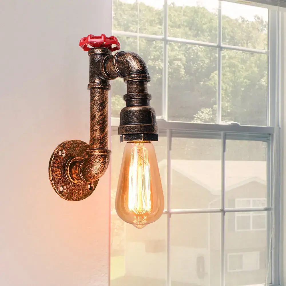 Industrial water pipe wall sconce in black and brass with red valve and exposed Edison bulb for decorbites industrial water decor