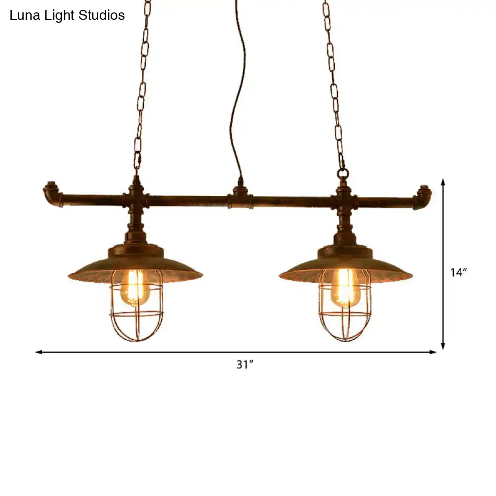 Industrial-style wire guard hanging light with weathered copper pipe design and two exposed bulbs with chain cord length