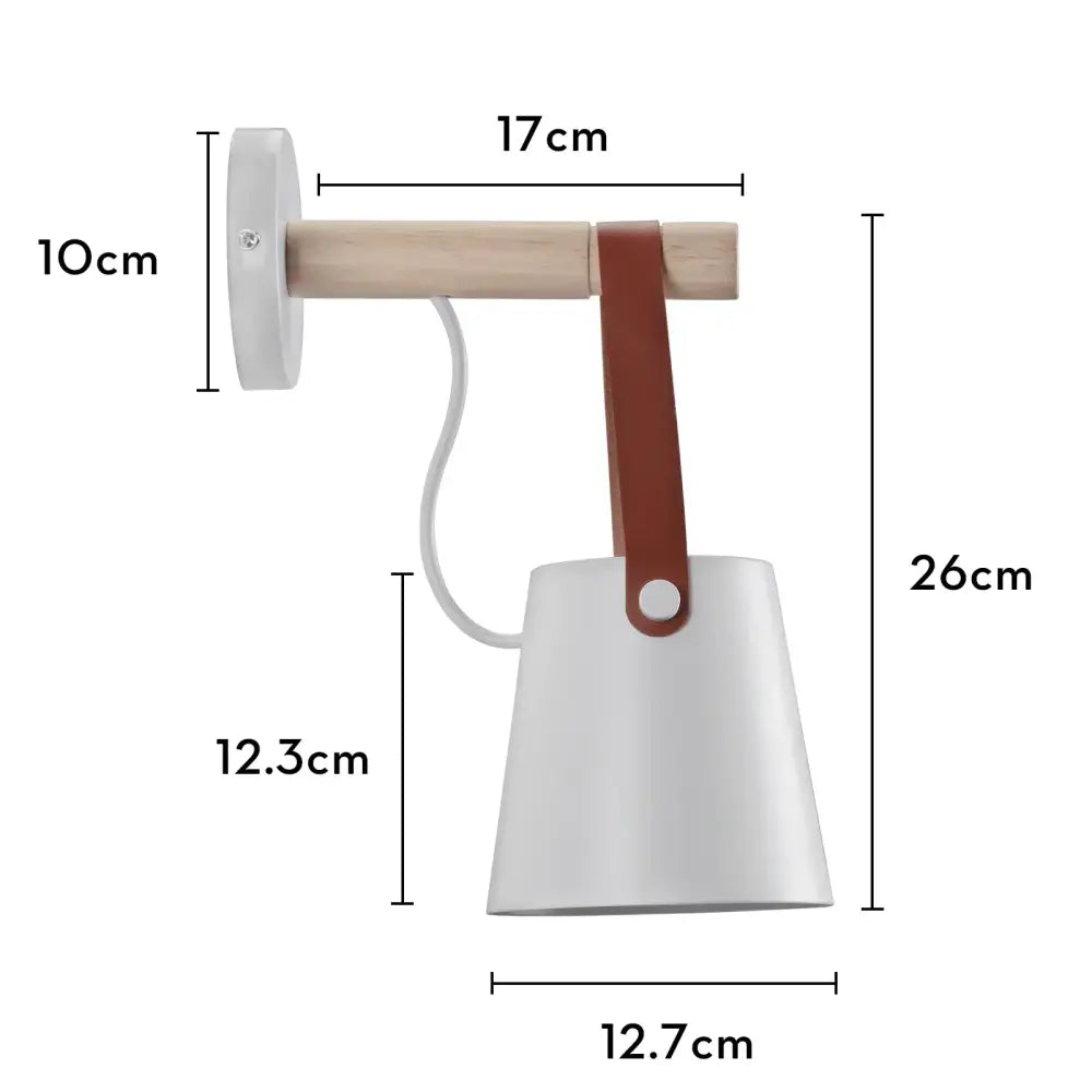 Industrial white and brass wall sconce with white ceramic lamp, light wood arm, and brown leather strap for decorbites industrial led lighting