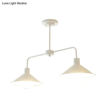 White industrial-style pendant light with two conical shades and angle arm for kitchen island lighting by DecorBites