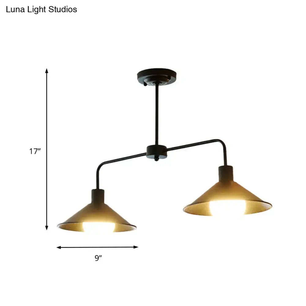 Industrial-style black metal pendant light with two warm conic shades and angle arm for kitchen island lighting