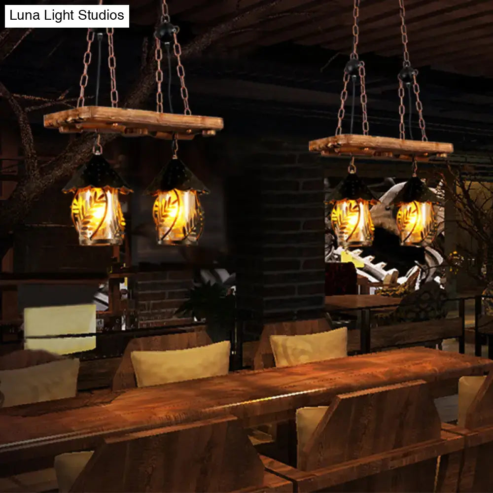 Rustic wooden industrial white clear lantern island lighting with glass lanterns etched leaves and warm amber light