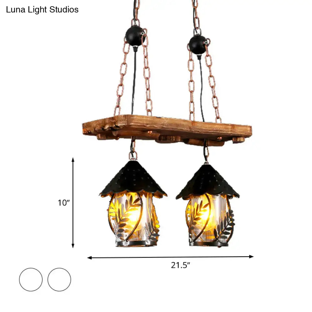 Industrial white clear wood lantern island lighting with rustic wooden plank and two hanging glass lanterns with black metal roofs