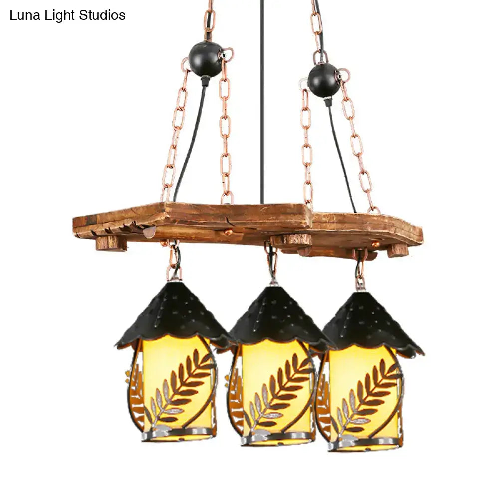 Rustic wooden chandelier with three amber glass lanterns and black metal roofs for industrial white clear lantern island lighting