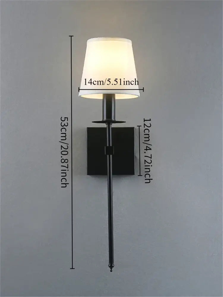 Black metal wall lamp with white fabric lampshade and brass finish from decorbites industrial white wall collection