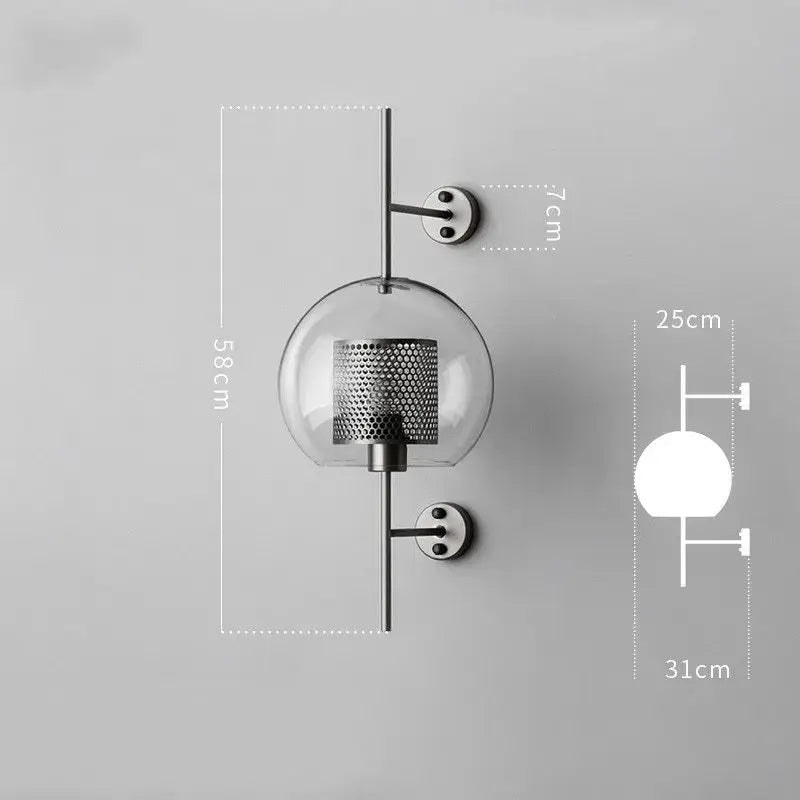 Modern minimalist wall lamp with clear glass globe and black perforated metal cylinder on chrome rods for decorbites industrial wind grid