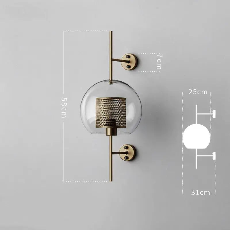 Brass-finished wall lamp with clear glass globe and perforated metal shade for decorbites industrial wind grid decor