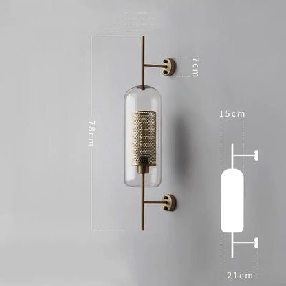 Brass-finished industrial wind grid wall lamp with clear glass cylinder and intricate mesh interior for living room decorbites industrial wind