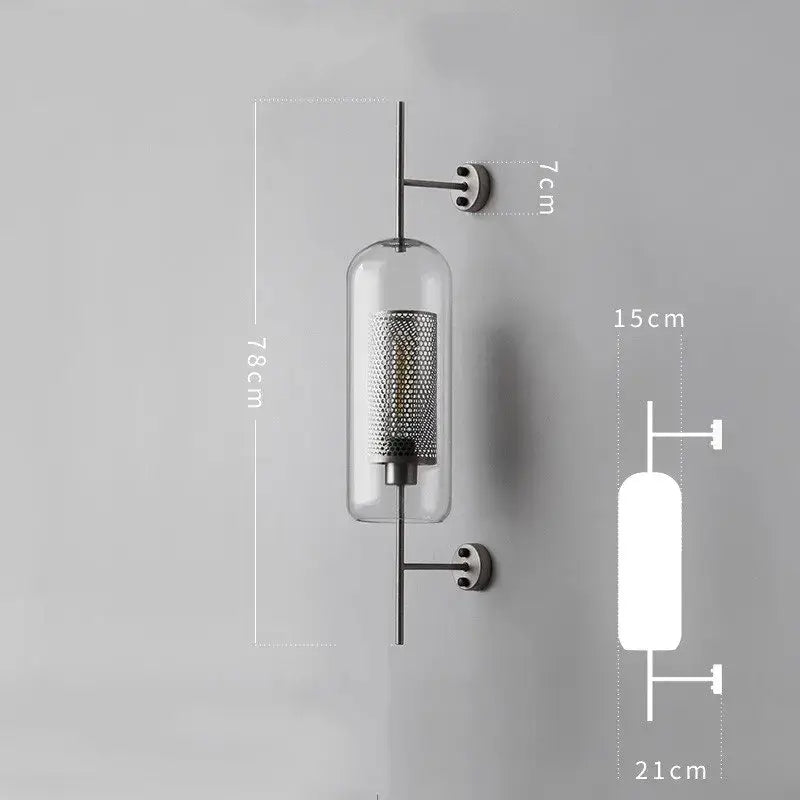 Modern minimalist black metal wall lamp with clear glass cylinder and perforated metal mesh interior decorbites industrial wind grid