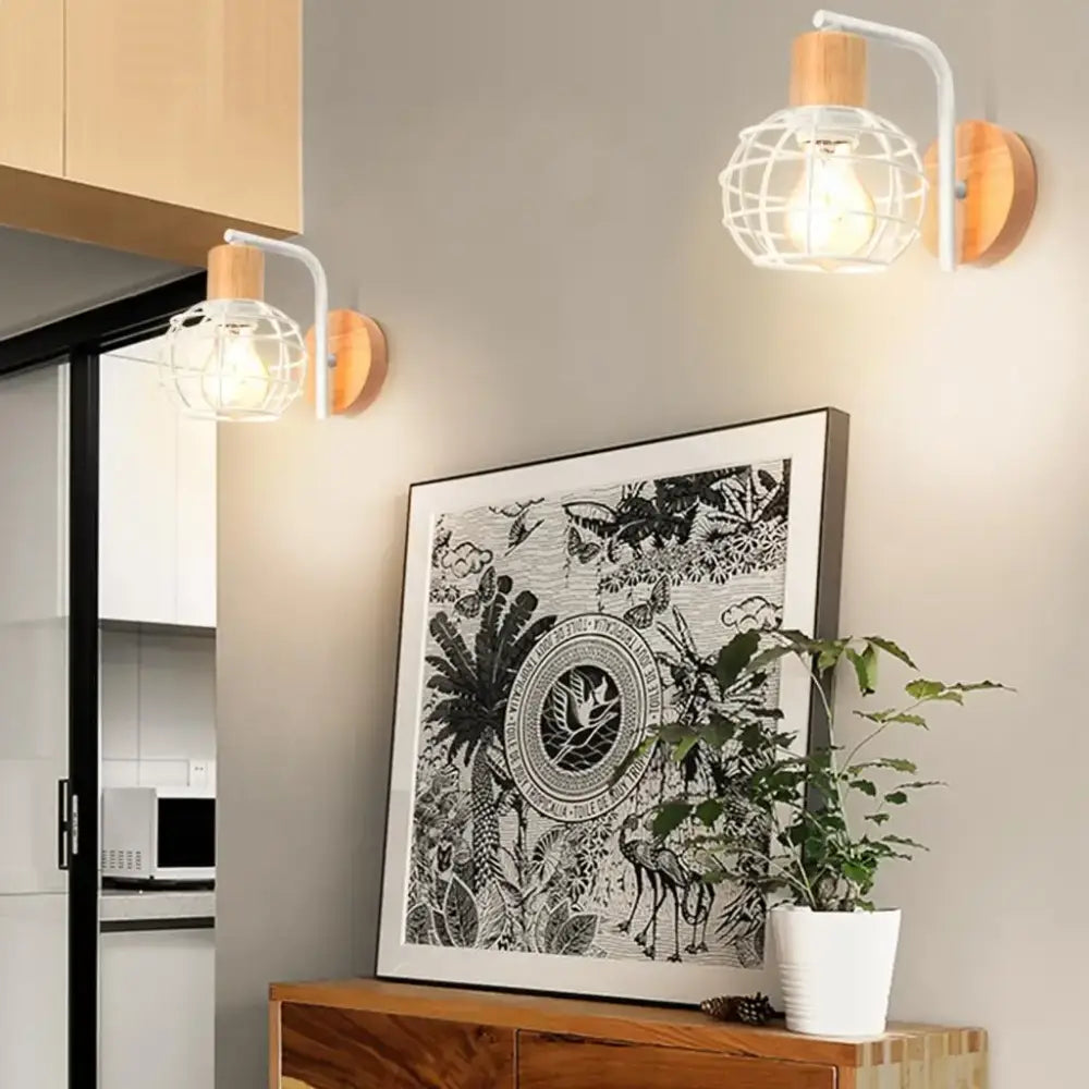 White wire cage wall sconce with wooden base and stem housing exposed bulb decorbites industrial wire cage light fixture